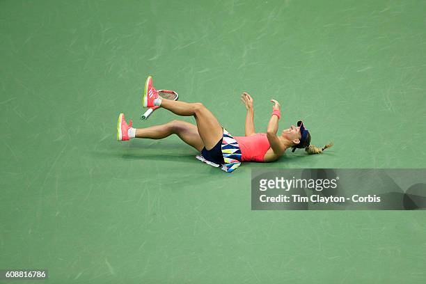 Open - Day 13 Angelique Kerber of Germany falls to the ground in celebration after winning the Women's Singles Final against Karolina Pliskova of the...