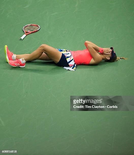 Open - Day 13 Angelique Kerber of Germany falls to the ground in celebration after winning the Women's Singles Final against Karolina Pliskova of the...