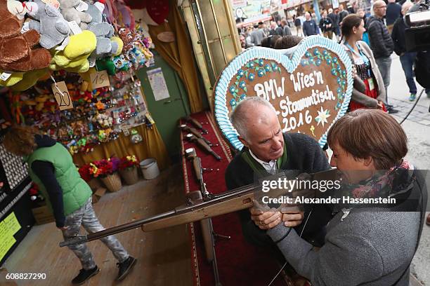 Rosi Mittermaier takes part in a shooting competition with Fritz Fischer during the BMW Wiesn Sport-Stammtisch 2016 at Kafers Wiesn Schaenke beer...