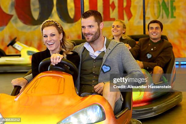Pilot Martin Tomczyk drives with Christina Surer at the auto scooter during the BMW Wiesn Sport-Stammtisch 2016 at Kafers Wiesn Schaenke beer tent at...