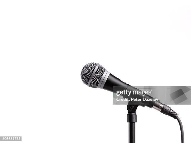 karaoke microphone with copy space - colour microphone stock-fotos und bilder