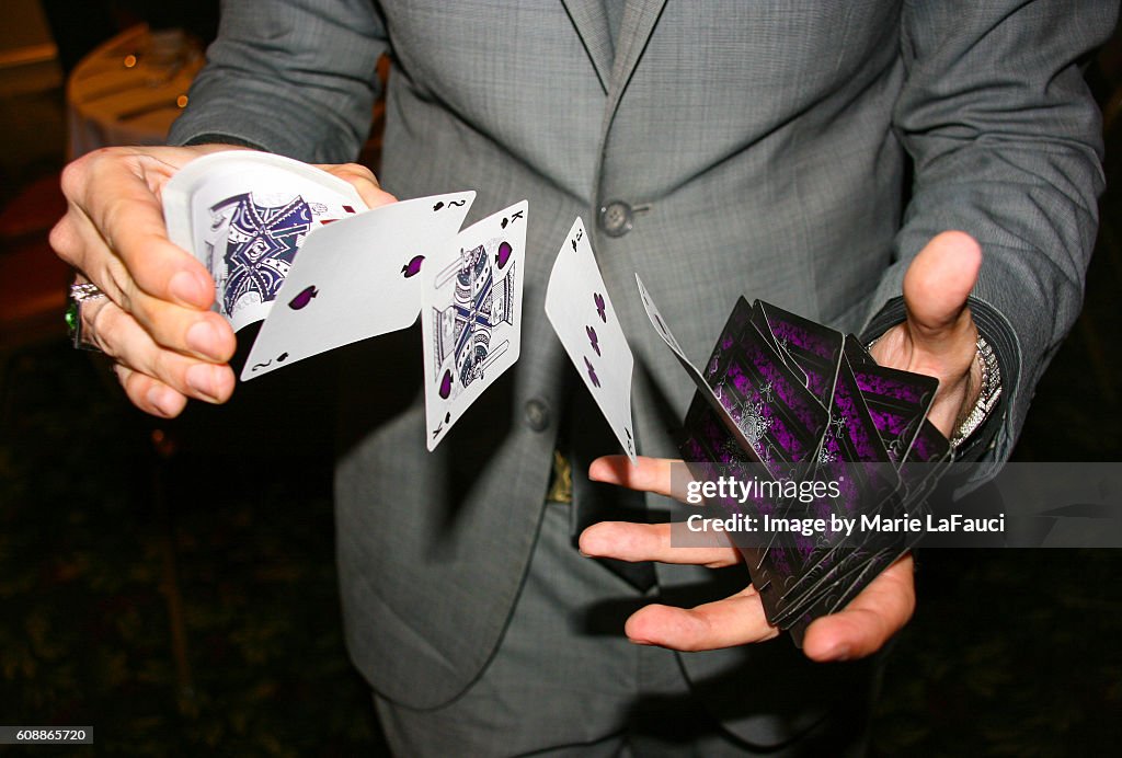 Magician illusionist performing card trick