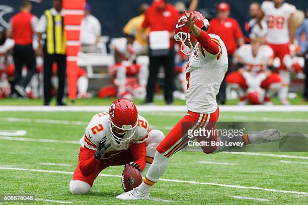 Cairo Santos of the Kansas City Chiefs kicks a field goal out of the hold of Dustin Colquitt against the Houston Texans at NRG Stadium on September...