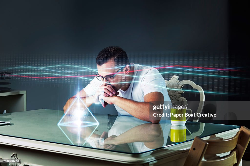 Man looking at business graph through projector