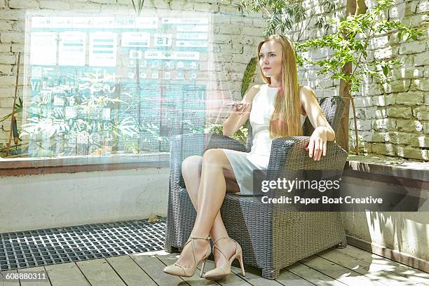 young lady browsing hologram internet with remote - holding hologram stock pictures, royalty-free photos & images