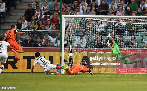 Jaroslaw Jach of Zaglebie Lubin is scoring a goal to Arkadiusz Malarz of Legia Warszawa during the LOTTO Extraklasa match between Legia Warszawa and...