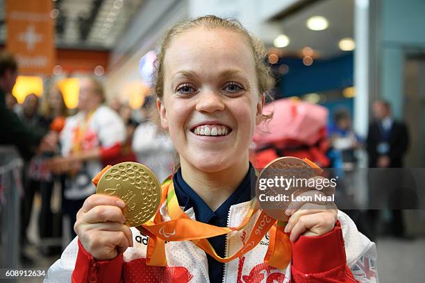 Gold medallist Ellie Simmonds poses with her medals after arriving on British Airways flight BA2016 from Rio de Janeiro to London Heathrow Terminal 5...