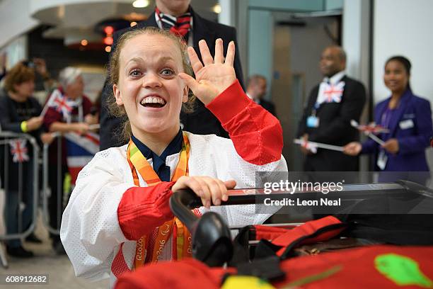 Gold medallist Ellie Simmonds is greeted by supporters after arriving on British Airways flight BA2016 from Rio de Janeiro to London Heathrow...