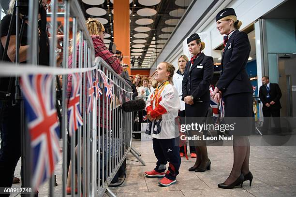 Gold medallist Ellie Simmonds is interviewed by members of the media after arriving on British Airways flight BA2016 from Rio de Janeiro to London...