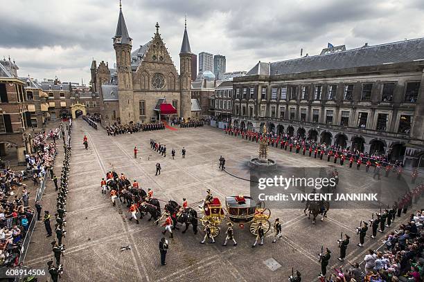 Dutch King Willem-Alexander and Queen Maxima arrive in the Glass Carriage during the 'Prinsjesdag' at the Binnenhof in The Hague, on September 20,...