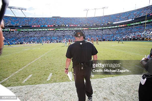 Head Coach Chip Kelly of the San Francisco 49ers stands on the sideline during the game against the Carolina Panthers at Bank of America Stadium on...