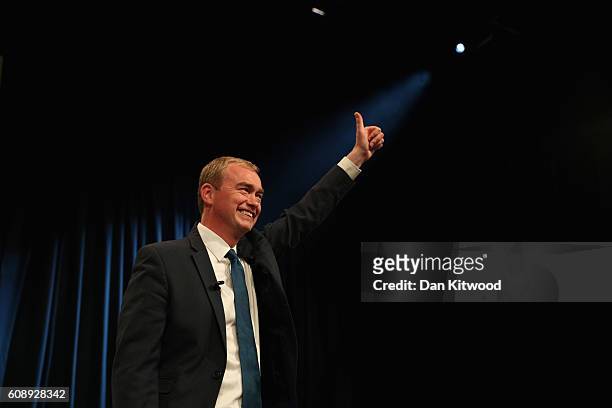 Tim Farron, leader of the Liberal Democrats, gestures to the audience after delivering a speech on the final day of the Liberal Democrats' 2016...