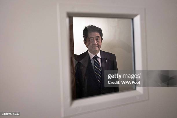 Japanese Prime Minister Shinzo Abe arrives for a bi-lateral meeting with British Prime Minister Theresa May at the United Nations Headquarters on...