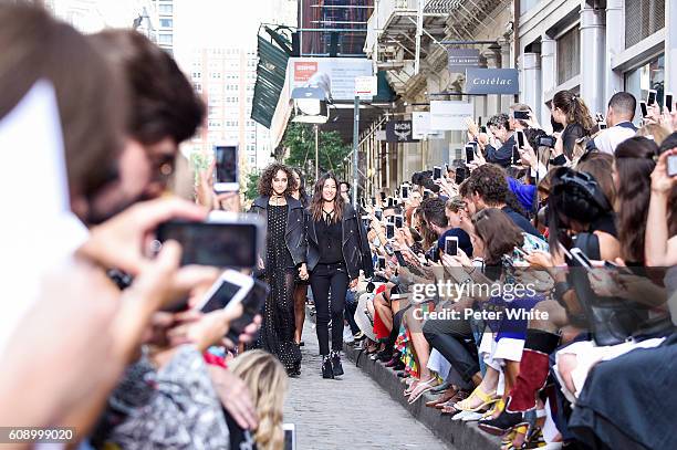 Fashion Designer Rebecca Minkoff and model acknowledge the applause of the audience after the Rebecca Minkoff Women's Fashion Show during New York...