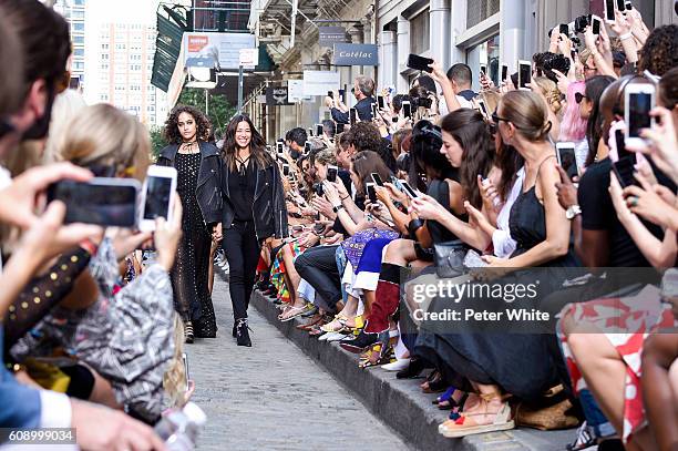 Fashion Designer Rebecca Minkoff and model acknowledge the applause of the audience after the Rebecca Minkoff Women's Fashion Show during New York...