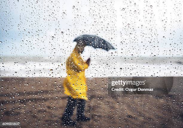 walking in the rain - rain stock pictures, royalty-free photos & images