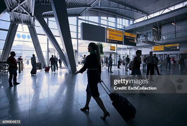 travelers at eindhoven airport, the netherlands - eindhoven airport stockfoto's en -beelden