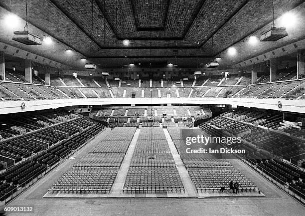 Preparing the empty auditorium at Earls Court for a run of Led Zeppelin concerts, London, May 1975.