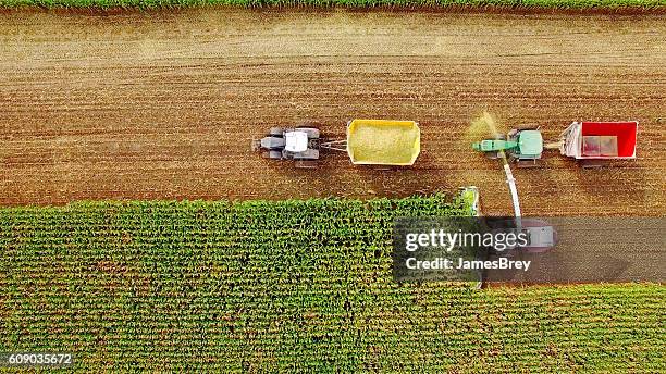 farm machines harvesting corn in september, viewed from above - midwest usa stockfoto's en -beelden