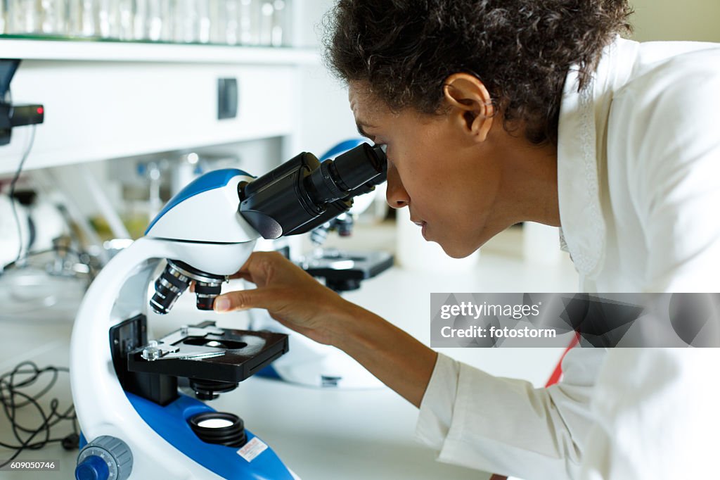 Scientist Using Microscope In Laboratory High-Res Stock Photo - Getty ...