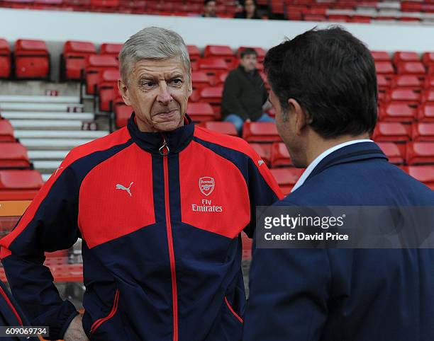Arsene Wenger the Arsenal Manager meets Philippe Montanier the Nottingham Forest Manager before the match between Nottingham Forest and Arsenal at...