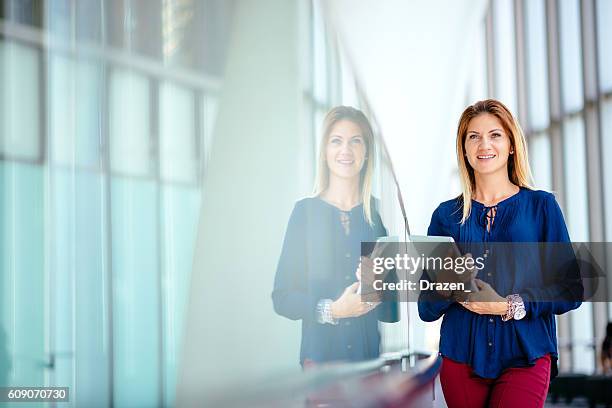 portrait of businesswoman, smiling and expressing positivity - styrelse bildbanksfoton och bilder