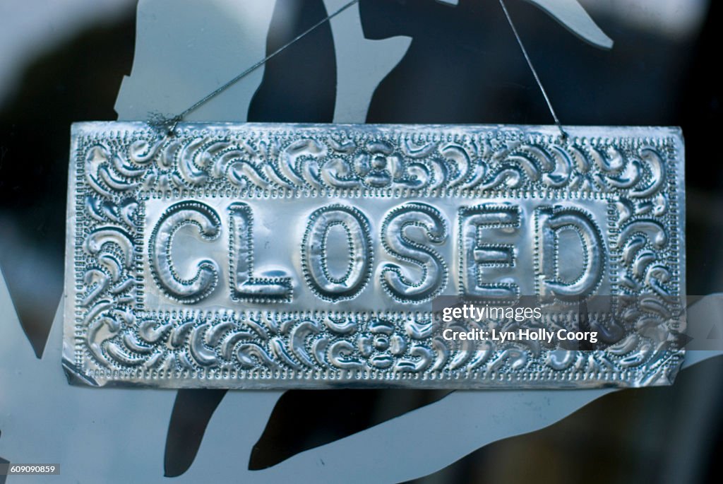 Closed metal sign