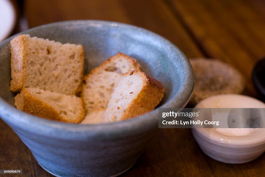 Artisan bread in blue china bowl