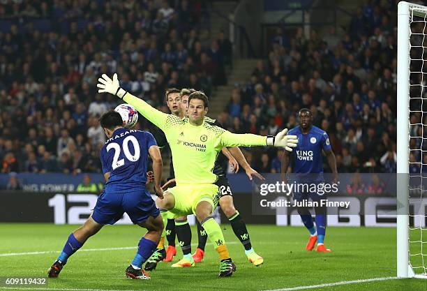 Shinji Okazaki of Leicester City scores the opening goal past Asmir Begovic of Chelsea during the EFL Cup Third Round match between Leicester City...