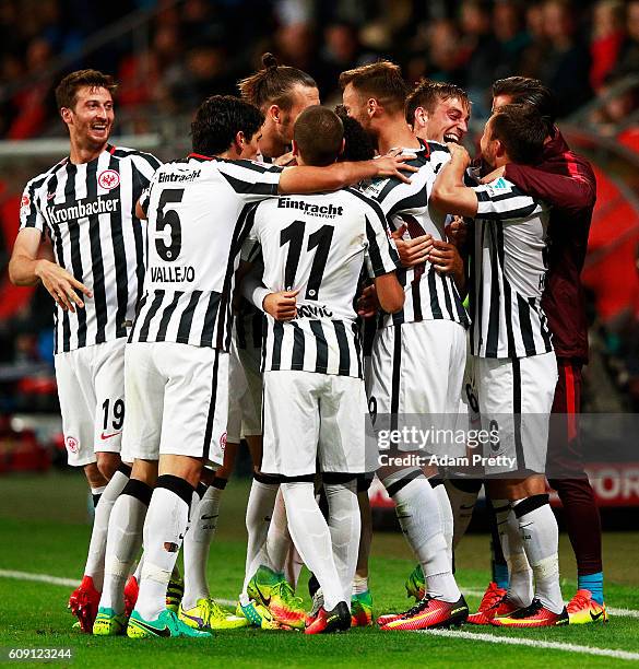 Bastian Oczipka of Eintracht Frankfurt is congratulated after scoring the second goal during the Bundesliga match between FC Ingolstadt 04 and...