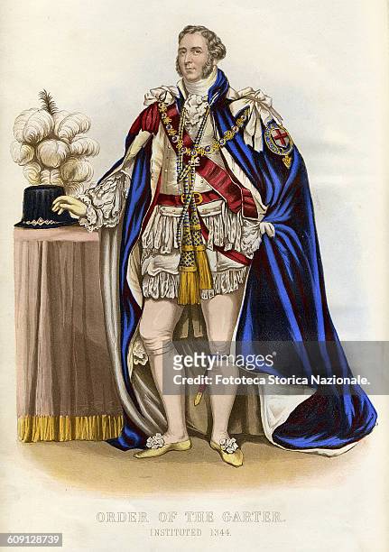 Formal dress of the Knight of the Order of the garter. Honi Soit Qui Mal Y Pense. It is the motto of the British chivalric Order of the Garter,...