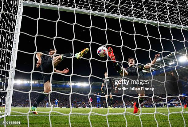 Cesar Azpilicueta of Chelsea and Gary Cahill of Chelsea attempt to stop the ball crossing the line as Shinji Okazaki of Leicester City scores his...