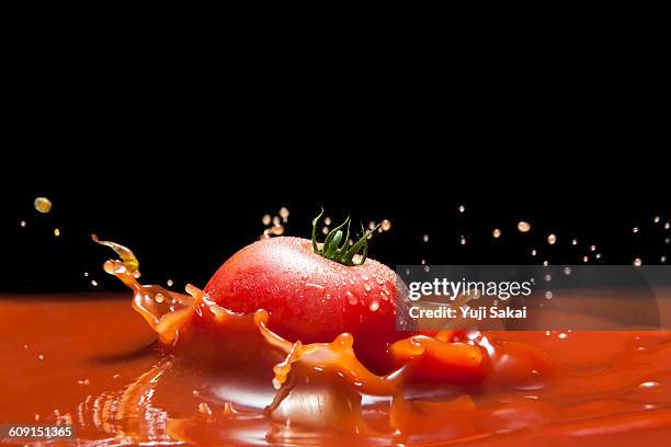 tomato fall down in tomato juice - tomato splat stock pictures, royalty-free photos & images