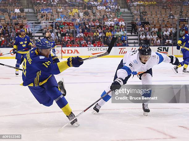 Jakob Silfverberg of Team Sweden takes a slapshot against Team Finland during the World Cup of Hockey tournament at the Air Canada Centre on...