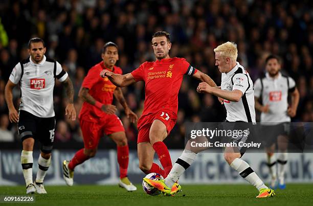 Jordan Henderson of Liverpool and Will Hughes of Derby County in action during the EFL Cup Third Round match between Derby County and Liverpool at...