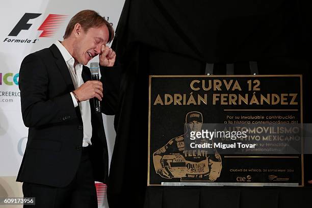 Former Mexican driver Adrian Fernandez gets emotional as he unveils a placard during a ceremony in his honour at Autodromo Hermanos Rodriguez on...