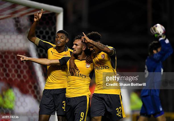 Lucas Perez of Arsenal celebrates scoring his team's third goal with Jeff Reine-Adelaide and Chuba Akpom of Arsenal during the EFL Cup Third Round...