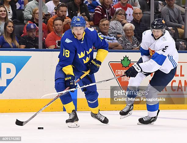 Jakob Silfverberg of Team Sweden stickhandles the puck with Jyrki Jokipakka of Team Finland chasing during the World Cup of Hockey 2016 at Air Canada...