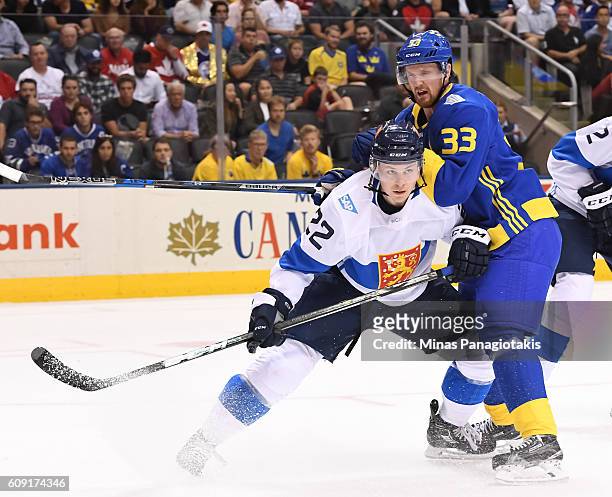 Ville Pokka of Team Finland battles for position with Henrik Sedin of Team Sweden during the World Cup of Hockey 2016 at Air Canada Centre on...