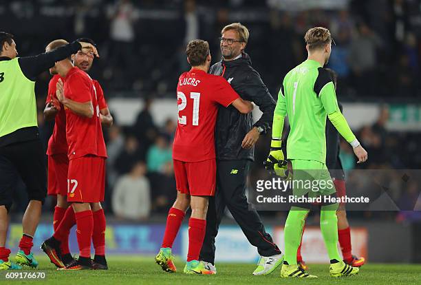 Jurgen Klopp, Manager of Liverpool and Lucas Leiva of Liverpool react after the full time whistle during the EFL Cup Third Round match between Derby...