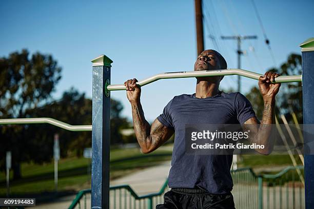 outdoor workout - pull ups stock pictures, royalty-free photos & images