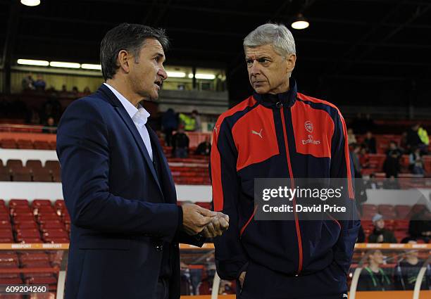 Arsene Wenger the Arsenal Manager meets Philippe Montanier the Nottingham Forest Manager before the match between Nottingham Forest and Arsenal at...