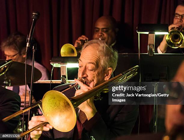 American Jazz musician John Mosca plays trombone as he leads the Vanguard Jazz Orchestra at the Village Vanguard, New York, New York, February 3,...