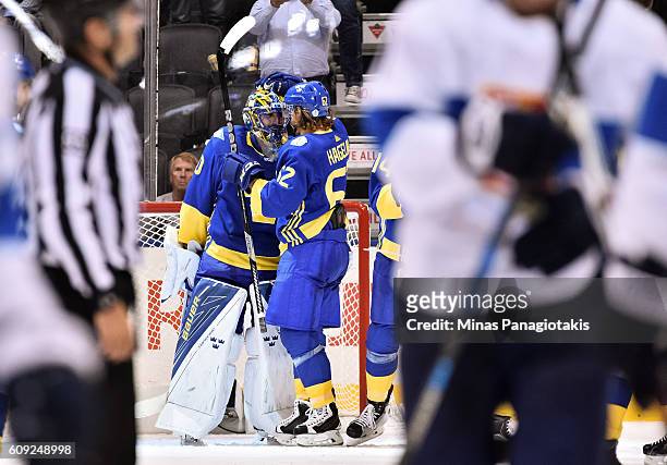 Henrik Lundqvist and Carl Hagelin of Team Sweden celebrate after a 2-0 win over Team Finland during the World Cup of Hockey 2016 at Air Canada Centre...