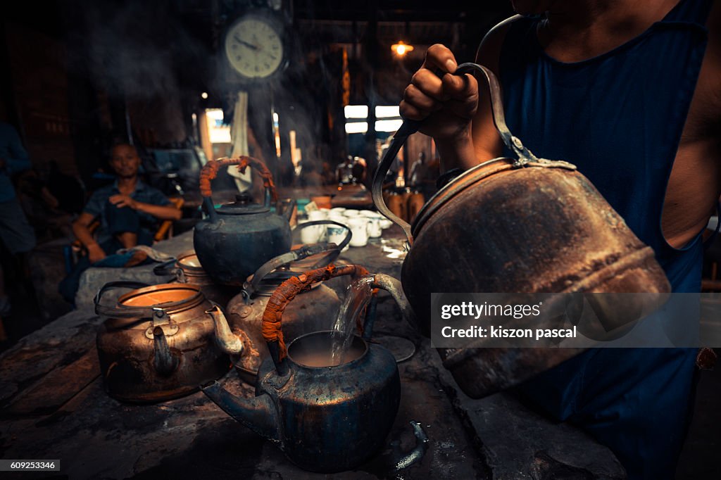 Tea pot in an old traditional tea house in China ( Chengdu , Sichuan )