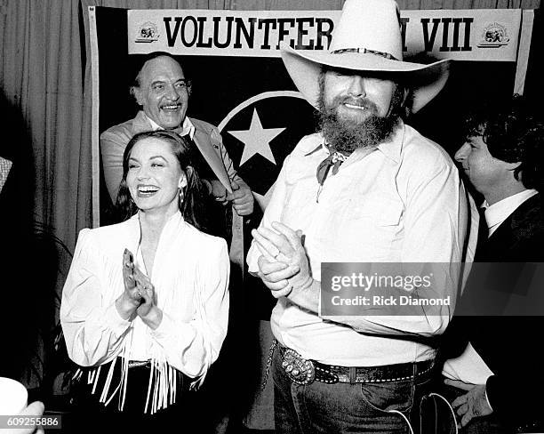 Nashville Charlie Daniels chats backstage with Crystal Gayle during Charlie Daniels Volunteer Jam VIII in Nashville, Tennessee on January 30, 1982