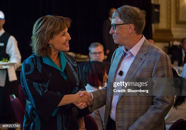 Christy Clark, premier of British Columbia, shakes hands with Bill Gates, co-founder of Microsoft Corp., during the Emerging Cascadia Innovation...