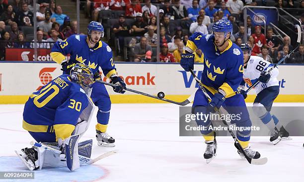 Henrik Lundqvist, Oliver Ekman-Larsson and Niklas Hjalmarsson of Team Sweden follow a loose puck during the World Cup of Hockey 2016 at Air Canada...