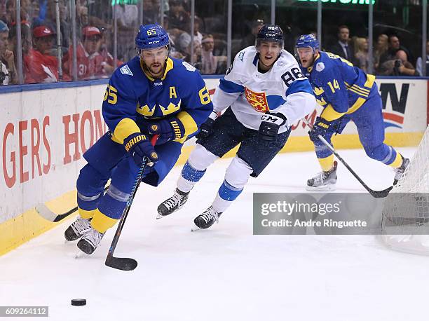 Erik Karlsson of Team Sweden stickhandles the puck with Teuvo Teravainen of Team Finland chasing during the World Cup of Hockey 2016 at Air Canada...