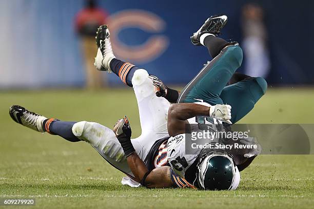 Darren Sproles of the Philadelphia Eagles is brought down by Jerrell Freeman of the Chicago Bears during a game at Soldier Field on September 19,...